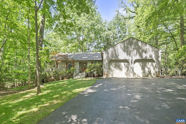 2 Whippoorwill Ln, Palmyra, VA 22963 - view of front of house featuring driveway, a garage, and a front yard
