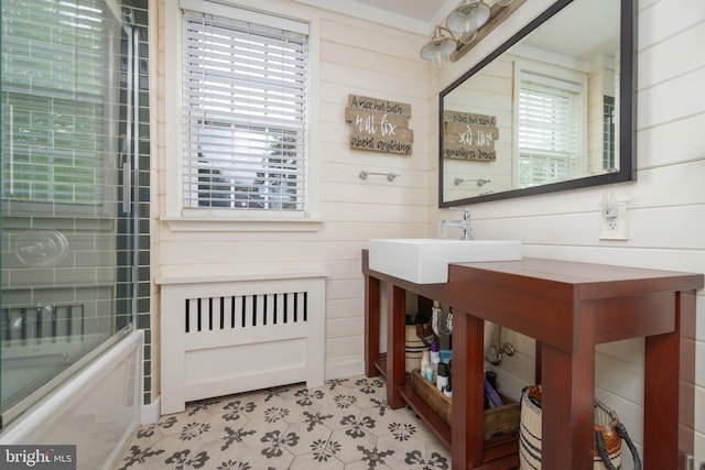 409 Regester Ave, Baltimore, MD 21212 - bathroom with tub / shower combination, wood walls, and a sink