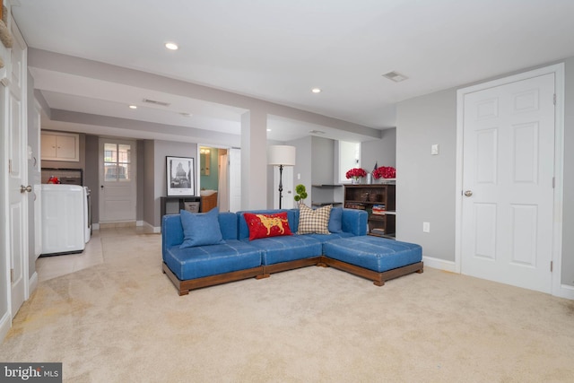 409 Regester Ave, Baltimore, MD 21212 - living area with washer / clothes dryer, light carpet, recessed lighting, and baseboards