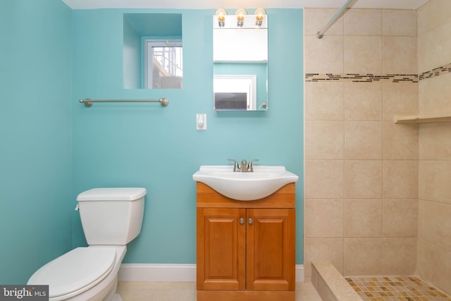 409 Regester Ave, Baltimore, MD 21212 - bathroom with toilet, vanity, a tile shower, and baseboards
