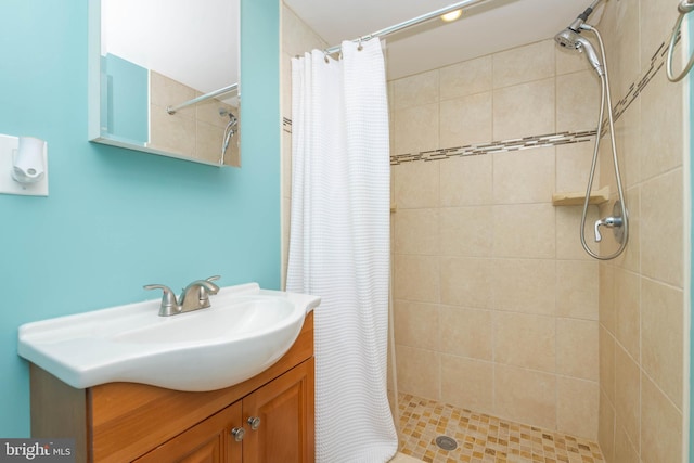 409 Regester Ave, Baltimore, MD 21212 - full bathroom featuring tiled shower and vanity