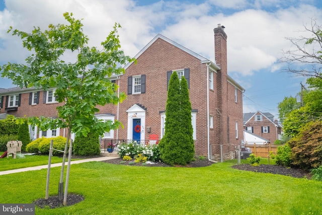 409 Regester Ave, Baltimore, MD 21212 - view of front facade with a chimney and brick siding