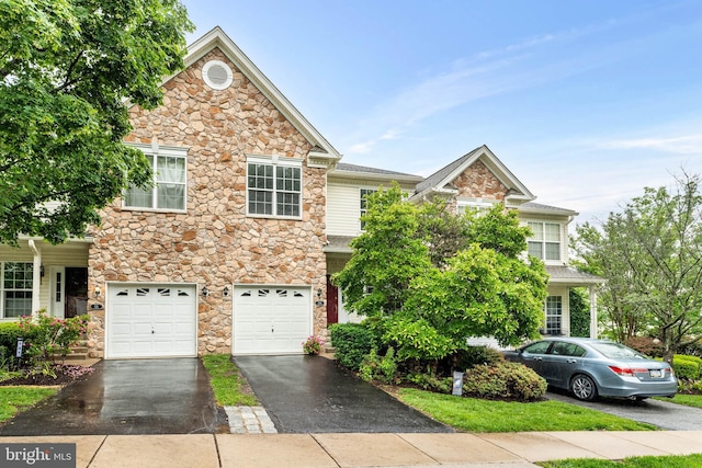 119 Fringetree Dr, West Chester, PA 19380 - view of front of home featuring stone siding, driveway, and a garage