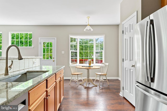 119 Fringetree Dr, West Chester, PA 19380 - kitchen with freestanding refrigerator, a sink, brown cabinets, dark wood finished floors, and plenty of natural light