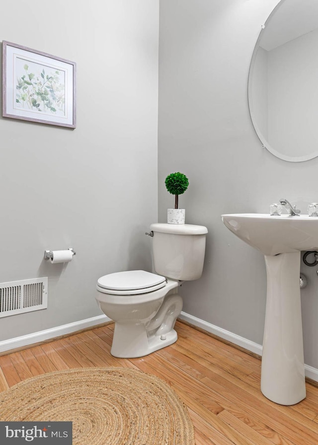 119 Fringetree Dr, West Chester, PA 19380 - bathroom featuring baseboards, toilet, and wood finished floors