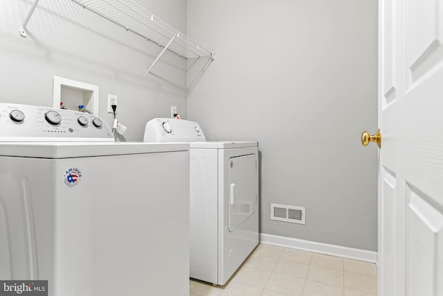119 Fringetree Dr, West Chester, PA 19380 - washroom with washer and dryer, baseboards, and light tile patterned floors