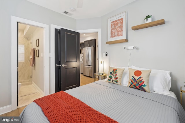 200 Hamilton St NW Unit 2, Washington, DC 20011 - bedroom with freestanding refrigerator, connected bathroom, baseboards, ceiling fan, and light wood-style flooring