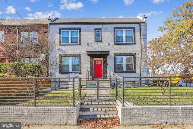 200 Hamilton St NW Unit 2, Washington, DC 20011 - townhome / multi-family property featuring a fenced front yard, brick siding, and a gate