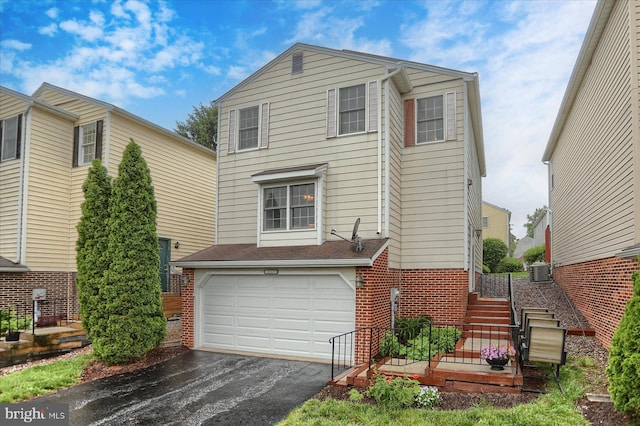 2217 Highland Cir, Harrisburg, PA 17110 - view of front of property with brick siding, driveway, a garage, and stairs