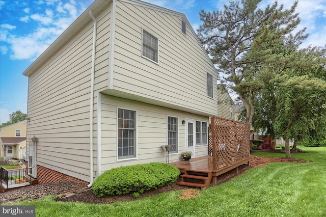2217 Highland Cir, Harrisburg, PA 17110 - back of property with a deck and a lawn