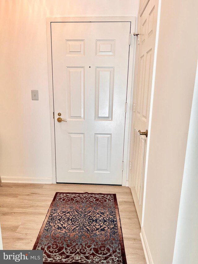 2900 N Leisure World Blvd Unit 515, Silver Spring, MD 20906 - doorway to outside with light wood finished floors and baseboards