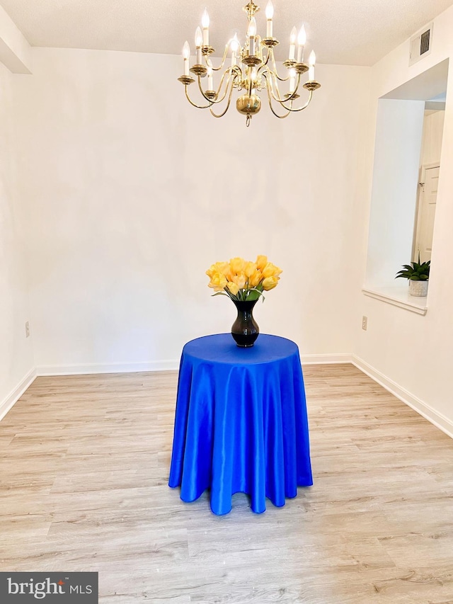 2900 N Leisure World Blvd Unit 515, Silver Spring, MD 20906 - sitting room featuring a chandelier, wood finished floors, and baseboards