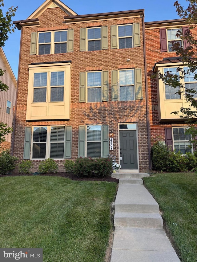 5908 Richmanor Ter, Upper Marlboro, MD 20772 - view of front of house with a front yard and brick siding