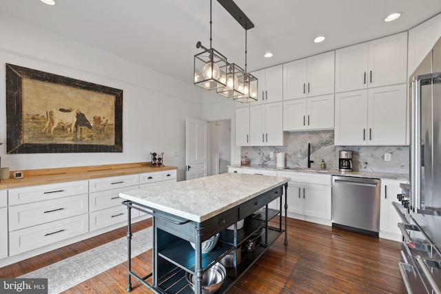 23350 Cedar Mountain Dr, Rapidan, VA 22733 - kitchen with stainless steel appliances, a sink, white cabinets, backsplash, and dark wood-type flooring