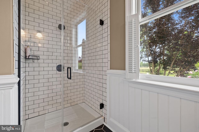 23350 Cedar Mountain Dr, Rapidan, VA 22733 - bathroom featuring a shower stall, a wainscoted wall, and a decorative wall