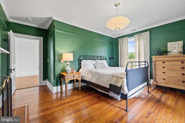 23350 Cedar Mountain Dr, Rapidan, VA 22733 - bedroom featuring crown molding, hardwood / wood-style floors, and baseboards