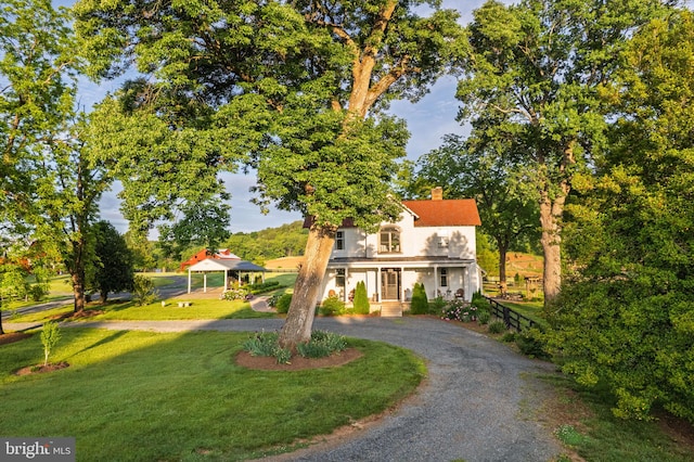 23350 Cedar Mountain Dr, Rapidan, VA 22733 - view of front of house with a chimney, a front lawn, curved driveway, and stucco siding