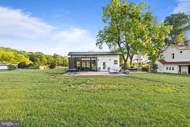 23350 Cedar Mountain Dr, Rapidan, VA 22733 - rear view of house with a lawn, a patio area, a standing seam roof, and metal roof