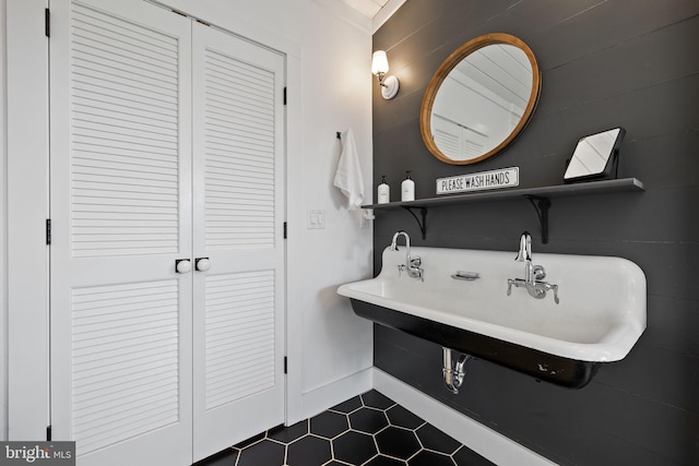 23350 Cedar Mountain Dr, Rapidan, VA 22733 - bathroom with tile patterned floors, a sink, baseboards, and a closet