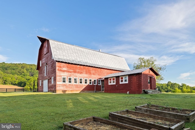 23350 Cedar Mountain Dr, Rapidan, VA 22733 - view of side of home with a vegetable garden, metal roof, and a barn