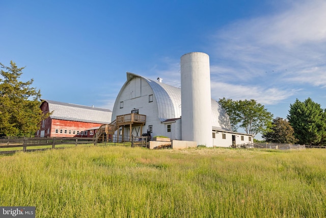 23350 Cedar Mountain Dr, Rapidan, VA 22733 - back of property with a gambrel roof, a chimney, metal roof, and a barn