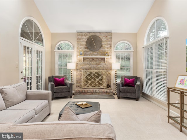12015 Meadowville Ct, Herndon, VA 20170 - living room featuring vaulted ceiling, healthy amount of natural light, carpet flooring, and a brick fireplace