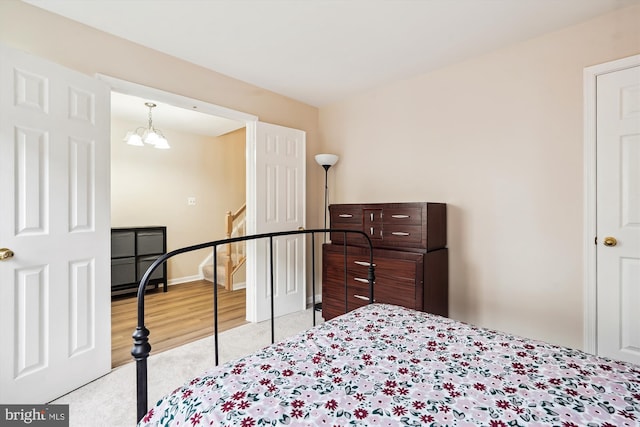 22953 Fleet Ter, Sterling, VA 20166 - bedroom with carpet, a chandelier, and baseboards