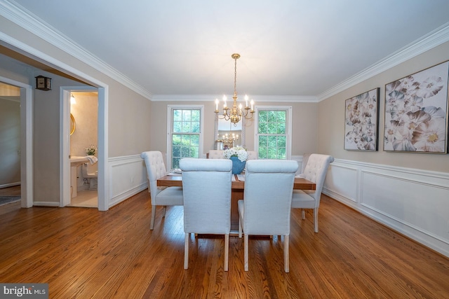 849 Milmar Rd, Newtown Square, PA 19073 - dining space with a chandelier, ornamental molding, wood finished floors, a decorative wall, and wainscoting