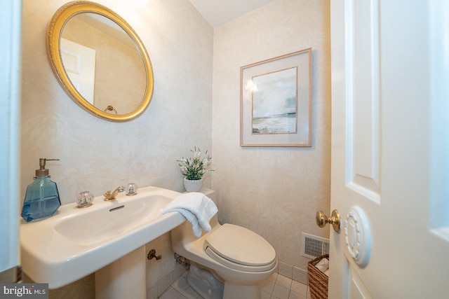 849 Milmar Rd, Newtown Square, PA 19073 - half bathroom with tile patterned floors, wallpapered walls, and toilet