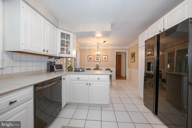 849 Milmar Rd, Newtown Square, PA 19073 - kitchen with black appliances, a chandelier, a peninsula, white cabinetry, and light countertops