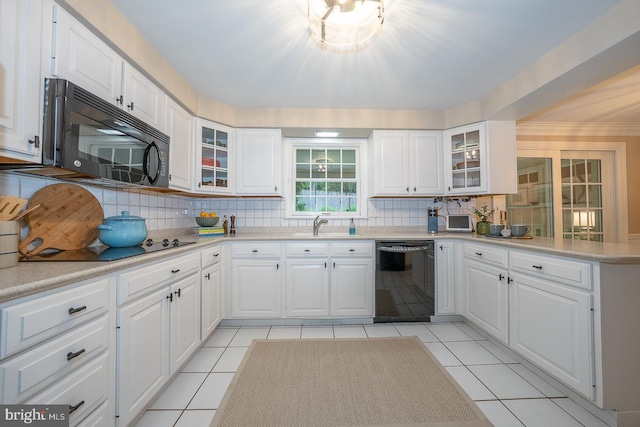 849 Milmar Rd, Newtown Square, PA 19073 - kitchen with black appliances, backsplash, a peninsula, and glass insert cabinets