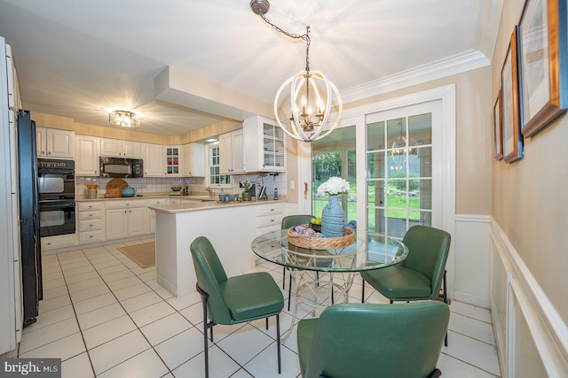 849 Milmar Rd, Newtown Square, PA 19073 - dining room featuring a chandelier, light tile patterned flooring, wainscoting, and ornamental molding