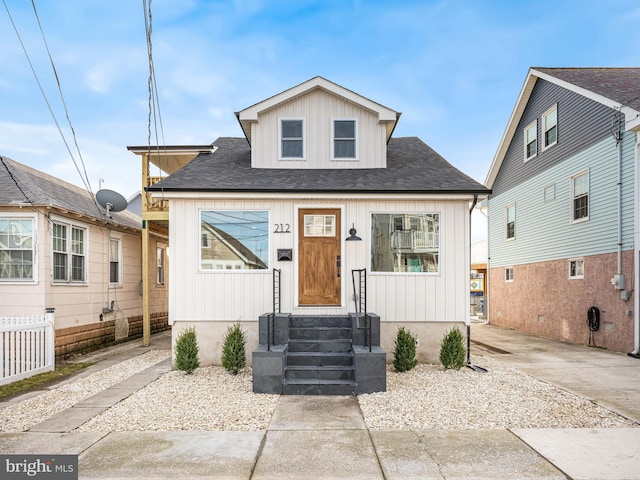 212 W 13th Ave, Wildwood, NJ 08260 - bungalow-style home with a shingled roof and board and batten siding