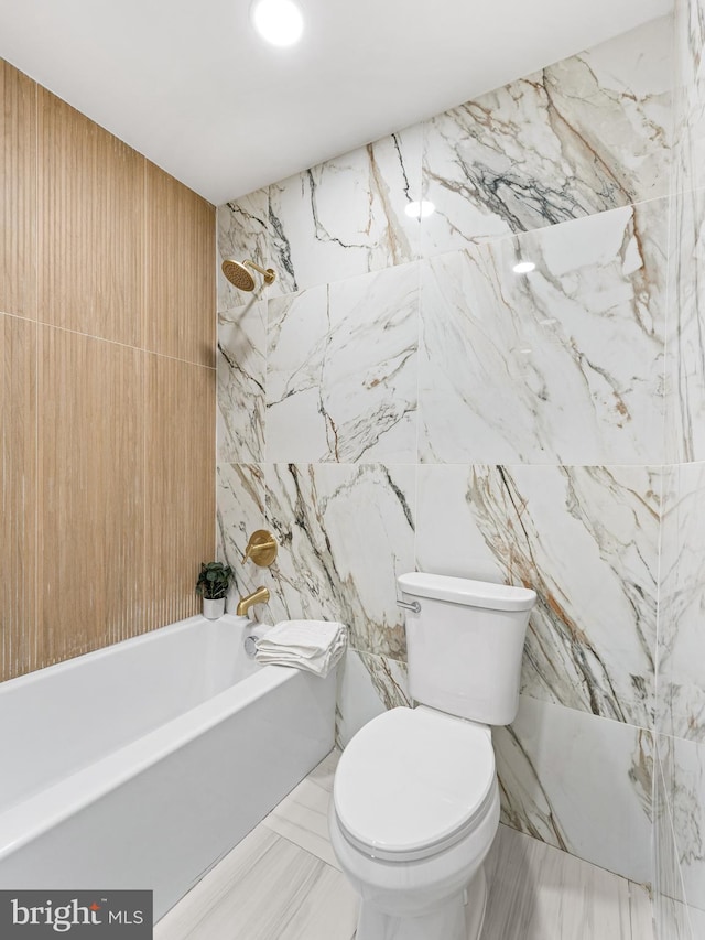 212 W 13th Ave, Wildwood, NJ 08260 - bathroom featuring tile walls, shower / washtub combination, marble tiled flooring, and toilet