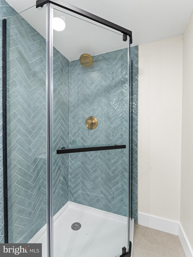 212 W 13th Ave, Wildwood, NJ 08260 - bathroom featuring a shower stall, tile patterned flooring, and baseboards