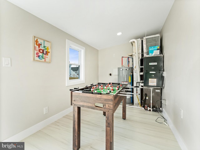 212 W 13th Ave, Wildwood, NJ 08260 - playroom with gas water heater, baseboards, wood finished floors, and recessed lighting