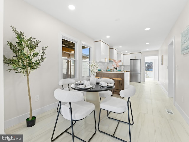 212 W 13th Ave, Wildwood, NJ 08260 - dining room with baseboards and recessed lighting