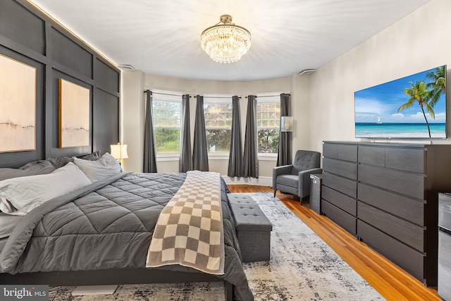 225 Wayne Ave, Lansdowne, PA 19050 - bedroom with a chandelier and wood finished floors