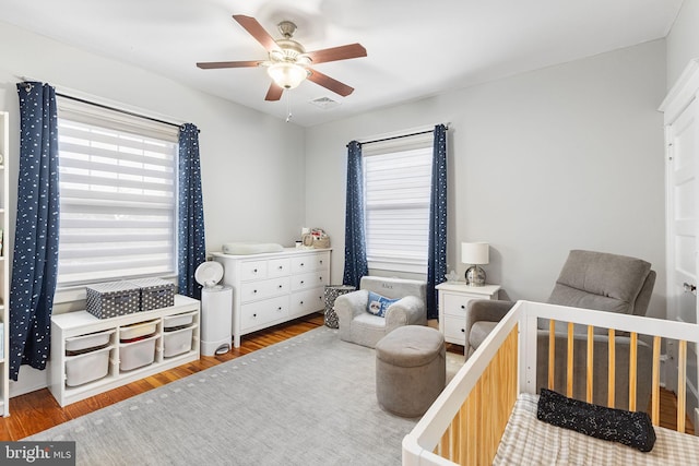 225 Wayne Ave, Lansdowne, PA 19050 - bedroom with multiple windows, wood finished floors, and ceiling fan