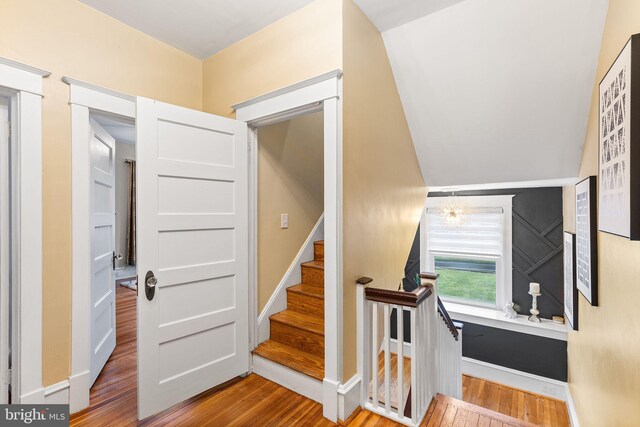 225 Wayne Ave, Lansdowne, PA 19050 - stairs with wood finished floors, baseboards, and a chandelier