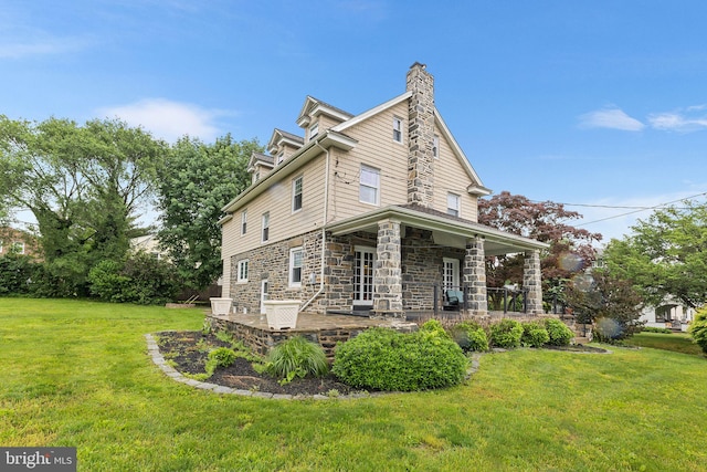 225 Wayne Ave, Lansdowne, PA 19050 - view of side of property featuring a yard, stone siding, and a chimney