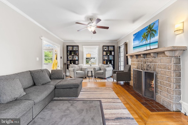 225 Wayne Ave, Lansdowne, PA 19050 - living room featuring crown molding, a ceiling fan, wood finished floors, and a brick fireplace