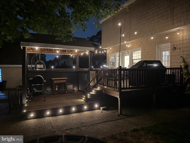 225 Wayne Ave, Lansdowne, PA 19050 - back of house at night with a deck