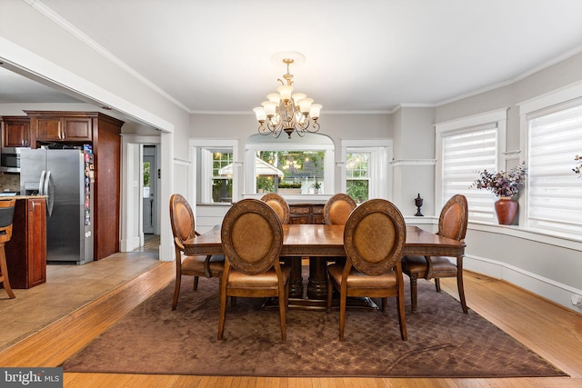 225 Wayne Ave, Lansdowne, PA 19050 - dining room featuring a chandelier, light wood-style flooring, and ornamental molding