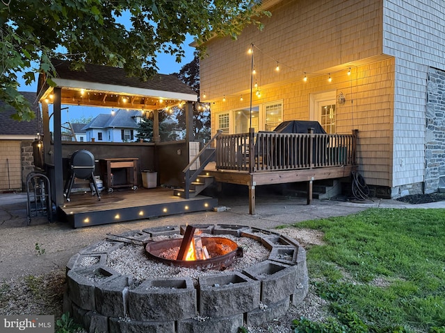 225 Wayne Ave, Lansdowne, PA 19050 - rear view of property with an outdoor fire pit, a wooden deck, and a gazebo