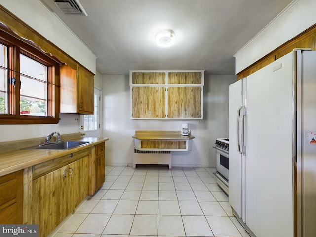 834 Amboy Ave, Edison, NJ 08837 - kitchen featuring white appliances, radiator, a sink, light countertops, and light tile patterned floors