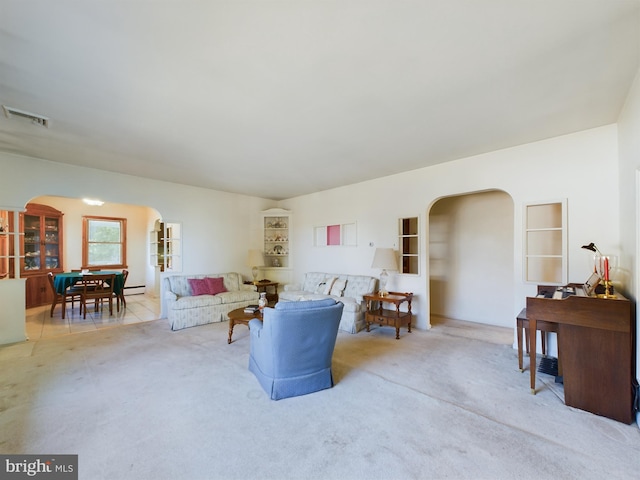 834 Amboy Ave, Edison, NJ 08837 - living area featuring arched walkways and carpet flooring