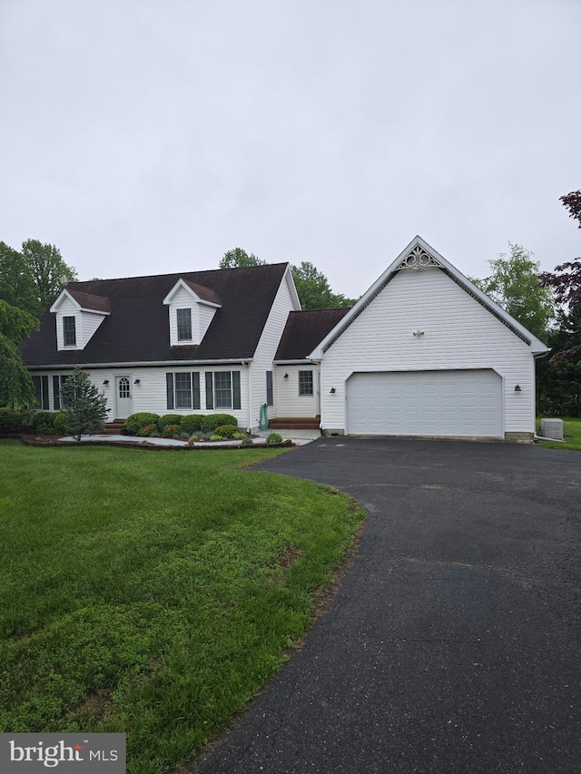 11307 Urieville Ln, Worton, MD 21678 - cape cod house with driveway, a front yard, and a garage
