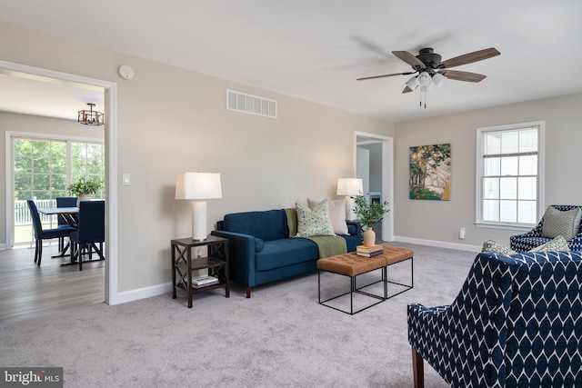 11307 Urieville Ln, Worton, MD 21678 - carpeted living area with ceiling fan and baseboards