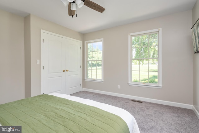 11307 Urieville Ln, Worton, MD 21678 - bedroom featuring light colored carpet, baseboards, a closet, and a ceiling fan